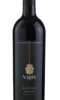 NADIV ELYONE CABERNET/SYRAH 750ML is a robust red wine sourced from the renowned vineyards of the region. This blend showcases rich flavors of dark berries
